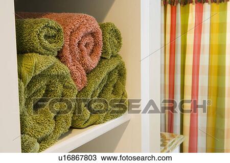 Detail pink and green rolled towels in cubby View Large Photo Image Stock Image - Detail pink and green rolled towels in cubby. Fotosearch