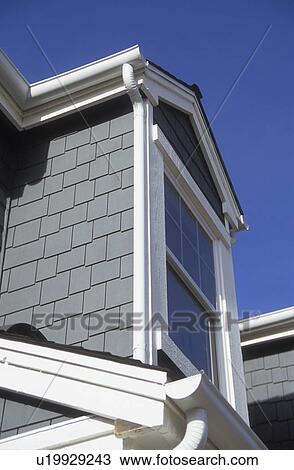 Stock Image - Detail shingled dormer on contemporary home. Fotosearch