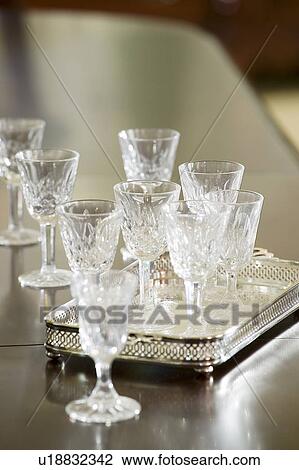 Stock Image - Detail wine glasses and serving tray. Fotosearch