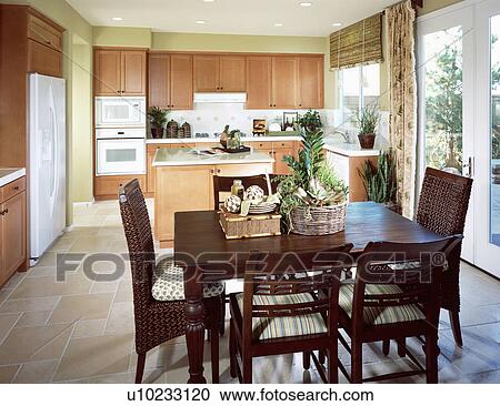 Stock Image - Dining table in bright contemporary kitchen. Fotosearch