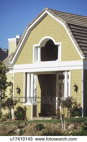 Exterior entrance yellow shingle style home View Large Photo Image Stock Image - Exterior entrance yellow shingle style home. Fotosearch