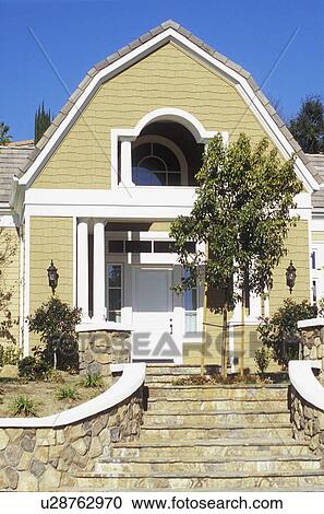 Exterior entrance yellow shingle style home View Large Photo Image Stock Image - Exterior entrance yellow shingle style home. Fotosearch