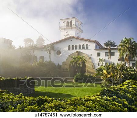 Stock Image - Exterior Santa Barbara Courthouse and sunken garden through morning mist. Fotosearch