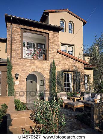Stock Photo - Front exterior Tuscan style home. Fotosearch