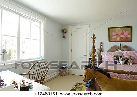 Stock Image - Girls bedroom with post bed. Fotosearch