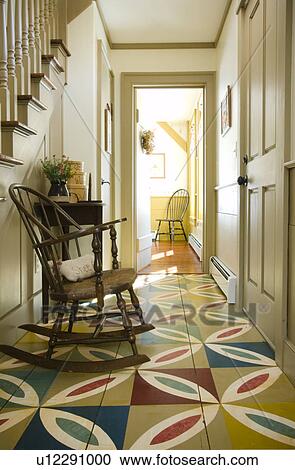 Stock Image - Hallway in colonial home with colorful wooden floor. Fotosearch