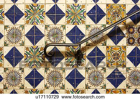 Hand rail against decorative tile View Large Photo Image Stock Photo - Hand rail against decorative tile. Fotosearch
