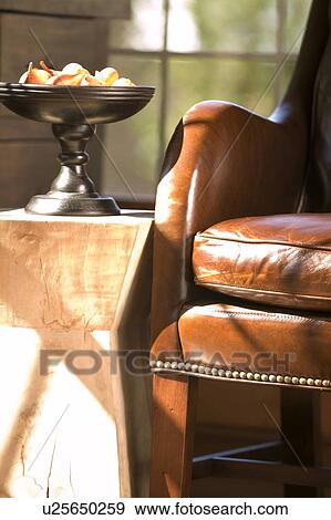 Leather stool near end table View Large Photo Image Stock Photo - Leather stool near end table. Fotosearch