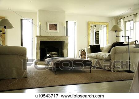 Stock Photo - Low angle living room with comfy sofa. Fotosearch