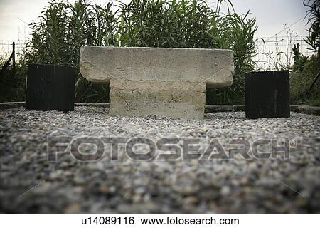 Stock Photograph - Low angle side view stone bench. Fotosearch