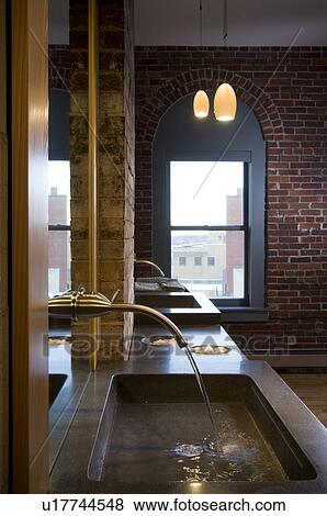 Modern bathroom sink with mirror mounted faucet View Large Photo Image Stock Photo - Modern bathroom sink with mirror mounted faucet. Fotosearch