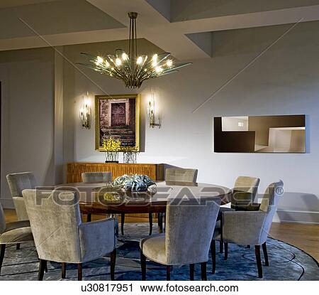 Modern dining room with large circular dining table View Large Photo Image Stock Image - Modern dining room with large circular dining table. Fotosearch