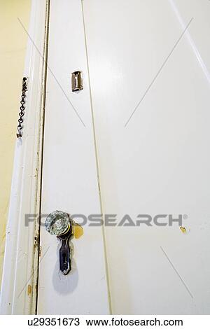 Stock Image - Old door with crystal door knob. Fotosearch