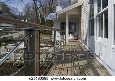 Porch and modern railing along home View Large Photo Image Stock Photography - Porch and modern railing along home. Fotosearch