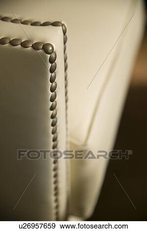 Stock Photo - Selective focus arm leather armchair. Fotosearch