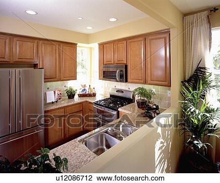 Stock Image - Simple traditional kitchen. Fotosearch