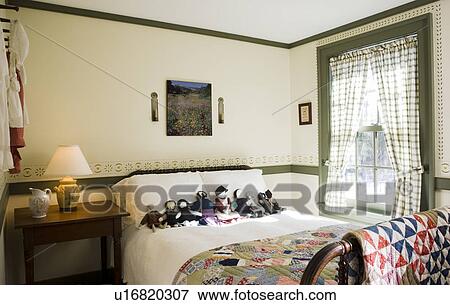 Small colonial bedroom with collection of Amish dolls on bed View Large Photo Image Stock Photo - Small colonial bedroom with collection of Amish dolls on bed. Fotosearch