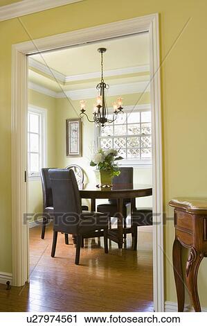Stock Image - Small dining room with hardwood floors. Fotosearch