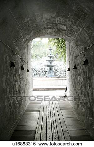 Stone tunnel leading to fountain View Large Photo Image Stock Photograph - Stone tunnel leading to fountain. Fotosearch