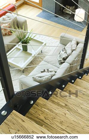 Top of wooden staircase overlooking living room View Large Photo Image Stock Image - Top of wooden staircase overlooking living room. Fotosearch