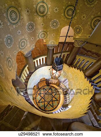Stock Image - View down grand spiral staircase. Fotosearch