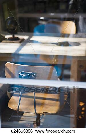View through window old fashion desk chairs at table View Large Photo Image Stock Photograph - View through window old fashion desk chairs at table. Fotosearch
