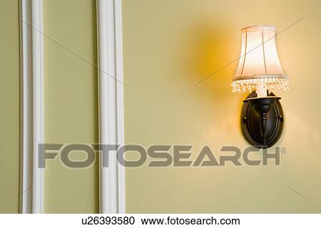 Stock Image - Wall sconce with lampshade. Fotosearch