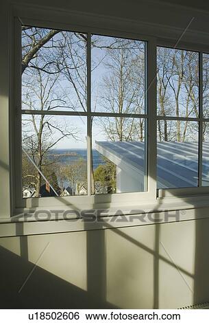 Stock Photograph - Window and shadows from window on wall. Fotosearch