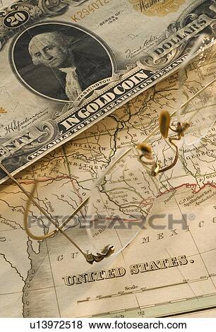 Stock Photo - Antique map and dollar bill. Fotosearch