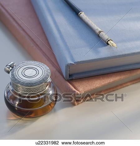 Stock Image - Antique pen, ink and journals. Fotosearch
