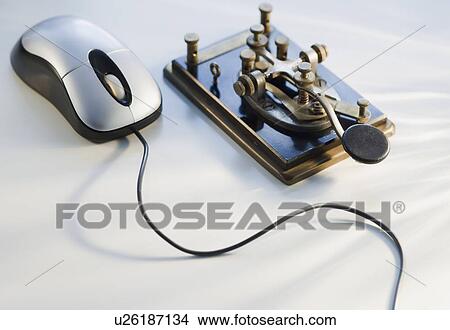 Antique telegraph key and computer mouse View Large Photo Image Picture - Antique telegraph key and computer mouse. Fotosearch