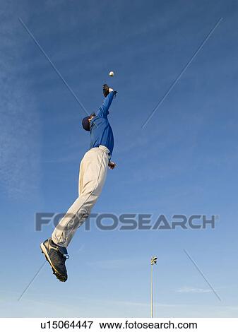 Baseball player catching ball View Large Photo Image Stock Photo - Baseball player catching ball. Fotosearch
