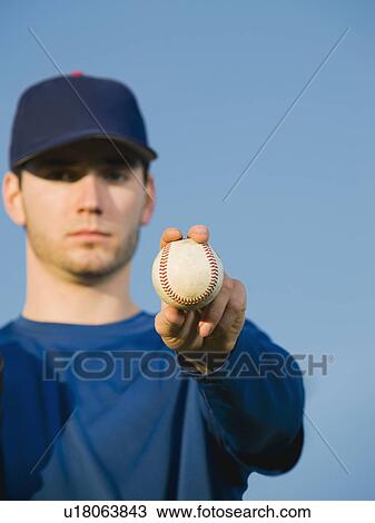 Baseball player holding ball View Large Photo Image Stock Image - Baseball player holding ball. Fotosearch
