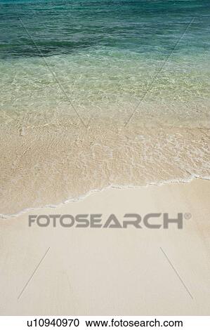 Beach and clear ocean water View Large Photo Image Stock Image - Beach and clear ocean water. Fotosearch
