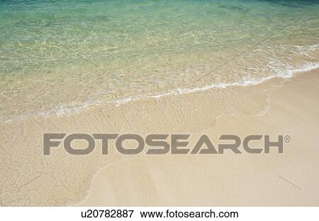 Beach and clear ocean water View Large Photo Image Stock Photo - Beach and clear ocean water. Fotosearch