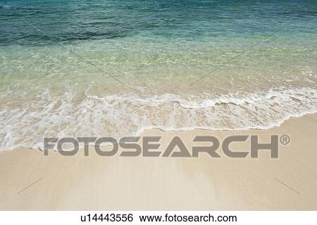 Beach and clear ocean water View Large Photo Image Stock Photograph - Beach and clear ocean water. Fotosearch