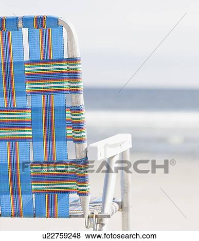 Stock Photo - Beach chair on beach. Fotosearch