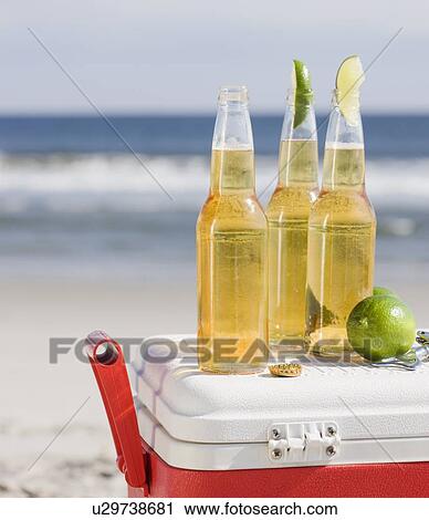 Beer and cooler on beach View Large Photo Image Stock Image - Beer and cooler on beach. Fotosearch