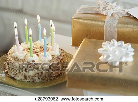 Birthday cake and gifts View Large Photo Image Stock Image - Birthday cake and gifts. Fotosearch