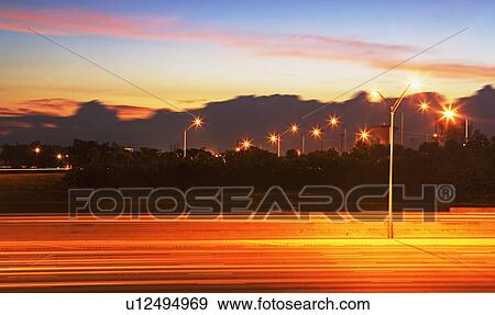 Blurred traffic headlights at night View Large Photo Image Stock Photo - Blurred traffic headlights at night. Fotosearch