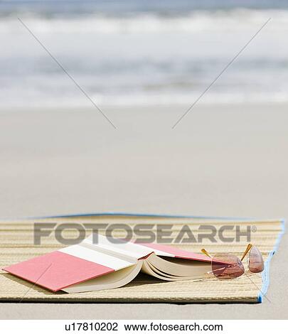 Book and sunglasses on beach View Large Photo Image Stock Image - Book and sunglasses on beach. Fotosearch
