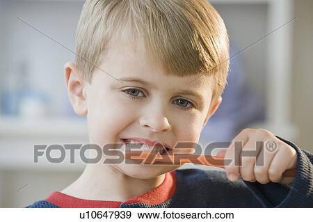 Stock Photo - Boy brushing teeth. Fotosearch