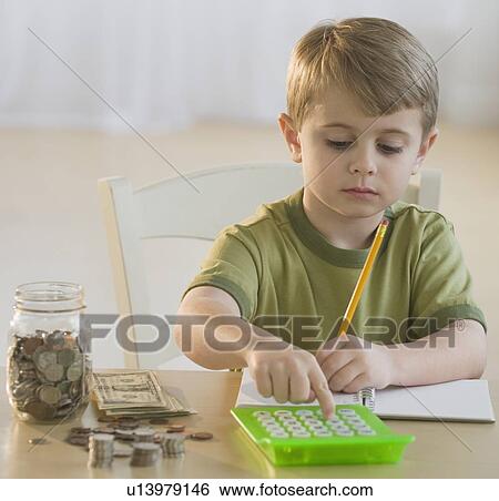 Boy calculating personal finances View Large Photo Image Stock Photograph - Boy calculating personal finances. Fotosearch