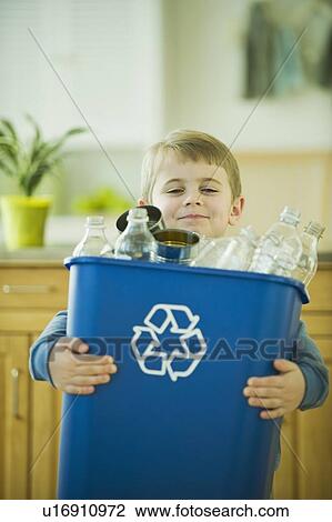 Boy carrying full recycling bin View Large Photo Image Stock Image - Boy carrying full recycling bin. Fotosearch