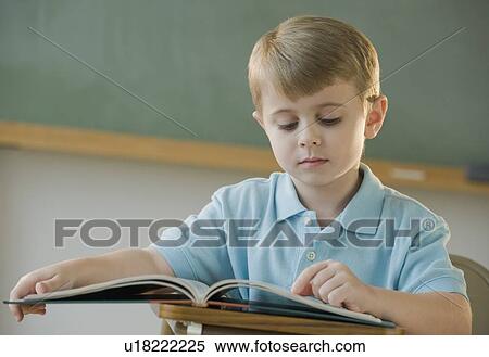 Boy reading book View Large Photo Image Stock Photography - Boy reading book. Fotosearch