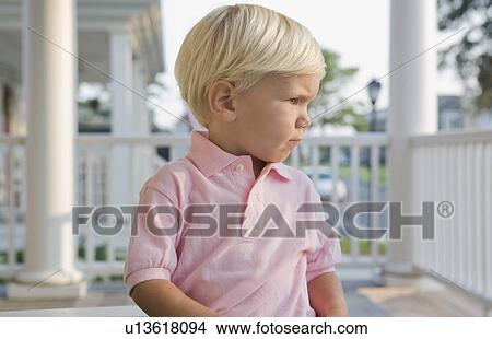 Picture - Boy sitting on porch. Fotosearch