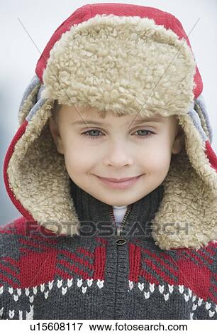 Stock Photo - Boy wearing winter hat. Fotosearch