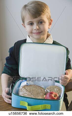 Boy with lunch box View Large Photo Image Stock Photograph - Boy with lunch box. Fotosearch