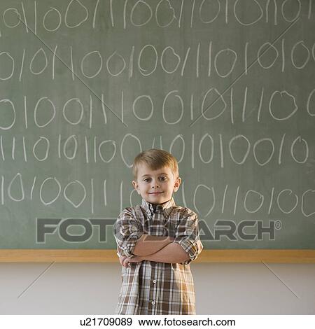 Boy writing binary code on blackboard View Large Photo Image Stock Photo - Boy writing binary code on blackboard. Fotosearch