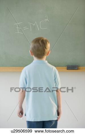 Boy writing formula on blackboard View Large Photo Image Stock Photo - Boy writing formula on blackboard. Fotosearch